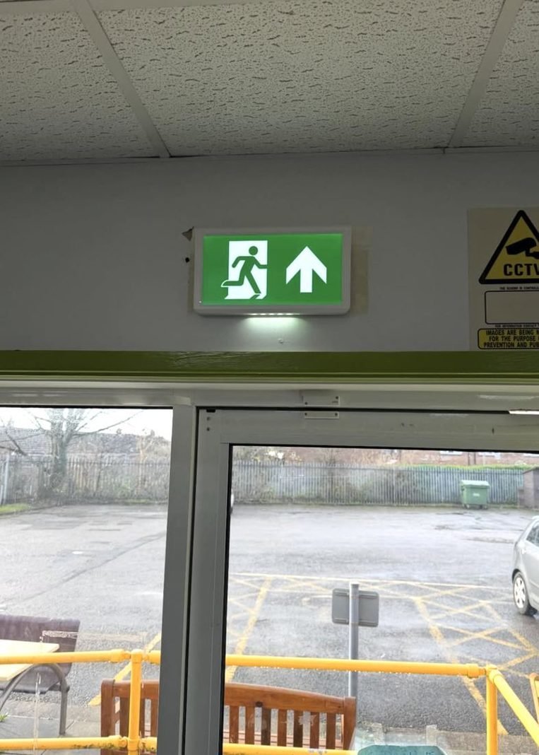 Illuminated emergency exit sign